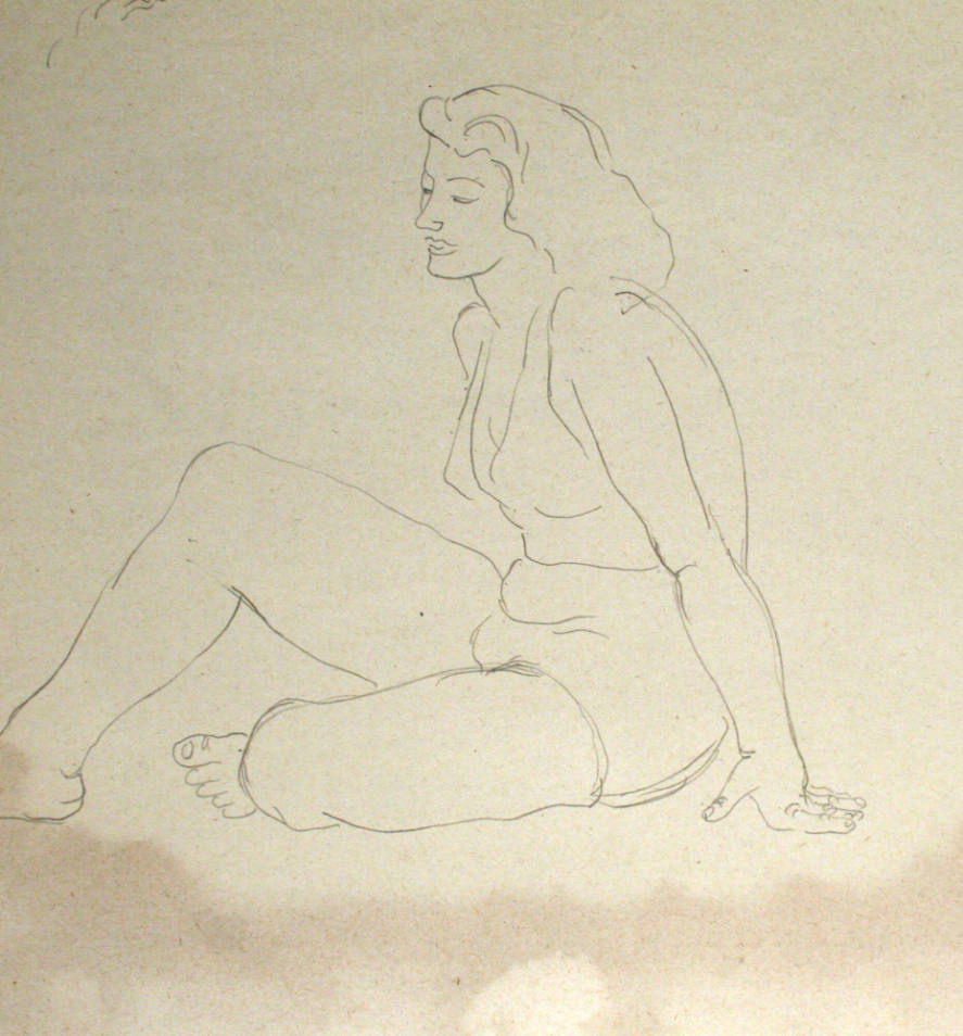 Woman in bikini seated on floor