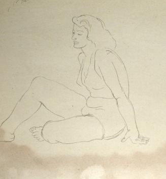 Woman in bikini seated on floor