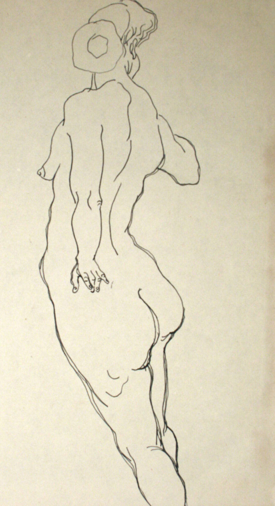 Nude woman standing, from the rear