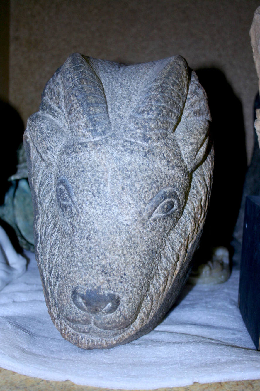 Stone carving of a ram's head