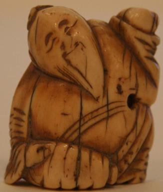 Carved ivory early Edo Period netsuke of a seated sage