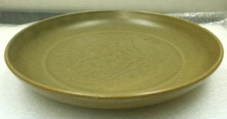 Ming Dynasty porcelain plate, light brown glazed with a faint floral incised center