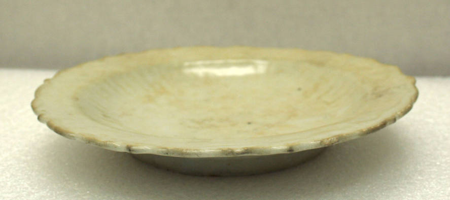 Ming Dynasty celadon glazed porcelain plate with incised floral center