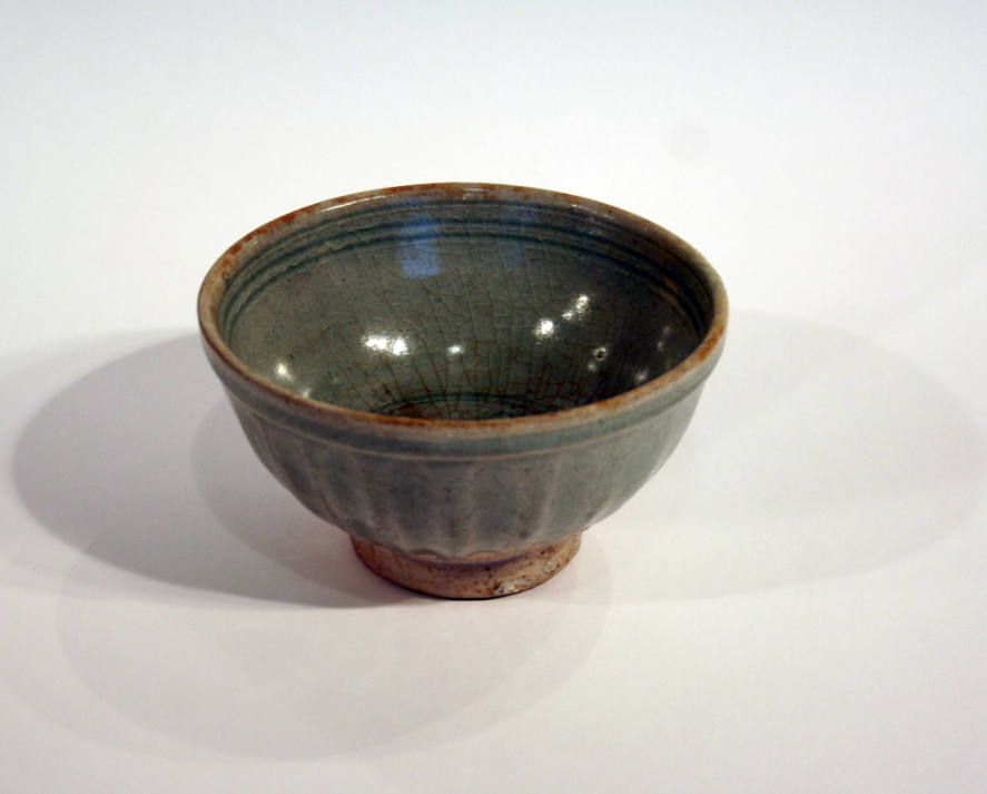 Glazed bowl with fluted sides and incised center