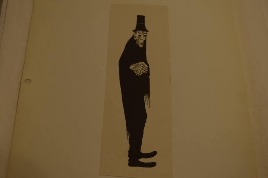 Man with clasped hands and tophat