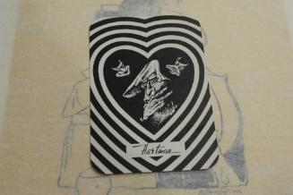 Playing card, ghoulish face in heart shape