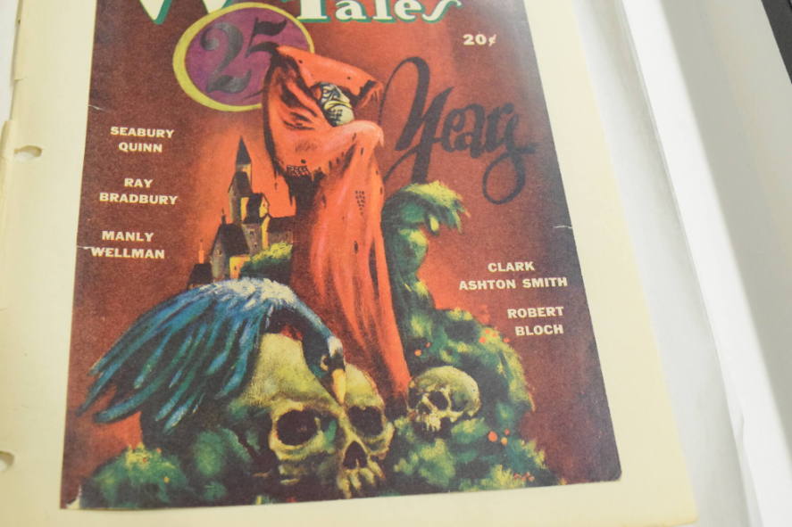 For March "Weird Tales" Ghoul with red cloak standing amoung skulls