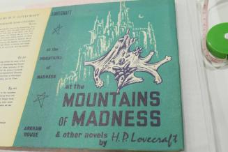 for "At the Mountains of Madness", Castle, moon, a bat-like figure in foreground