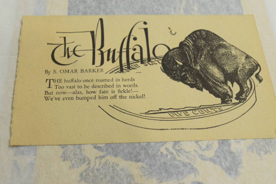 Buffalo standing on a nickel crescent moon