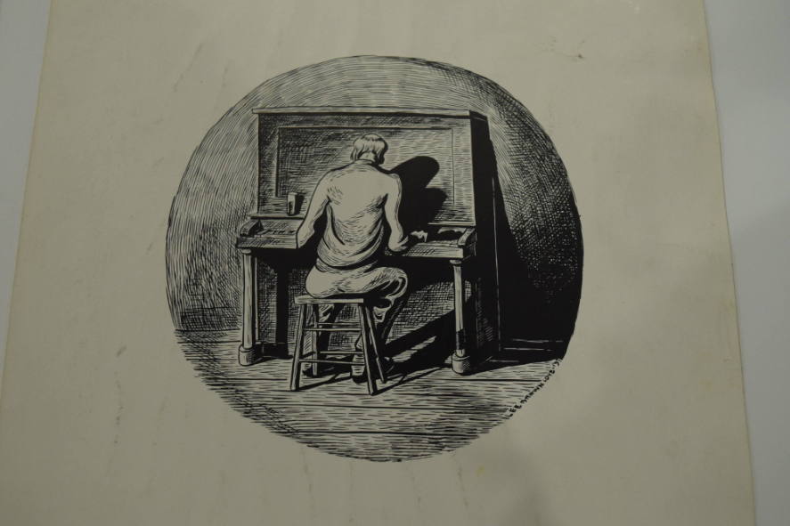 Man playing the piano with his back to the viewer