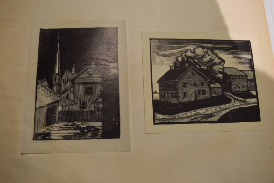 2 prints containing houses with church steeple