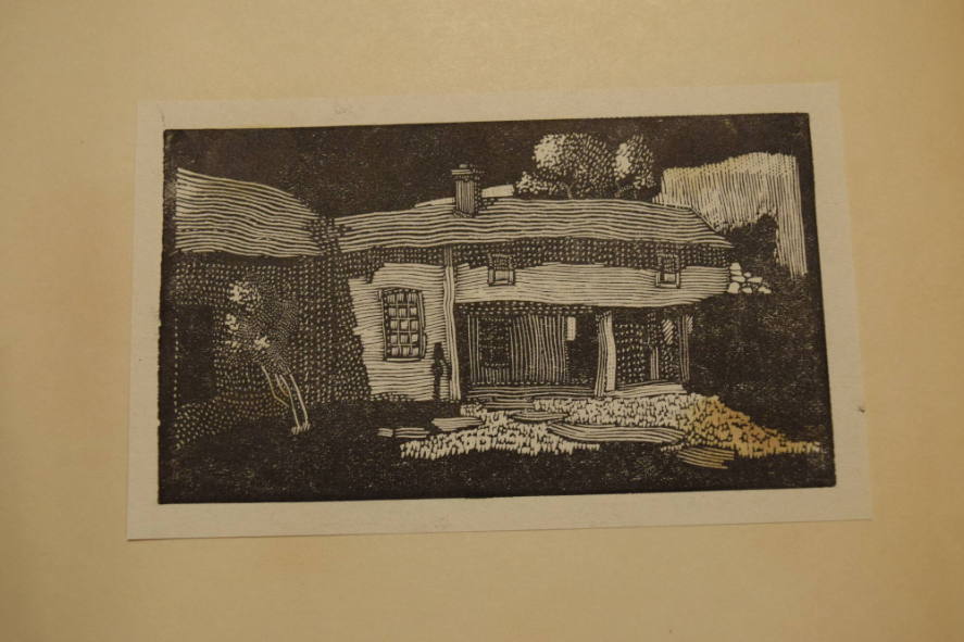 2 prints containing dooryard and man in cap reading a book