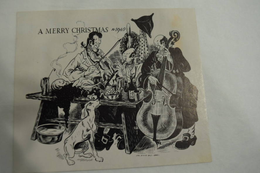 Christmas card of 3 men playing the violin, cello and horn with dog