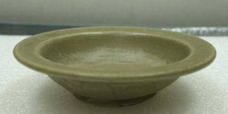 Sung Dynasty green glazed pottery dish with flaring rim