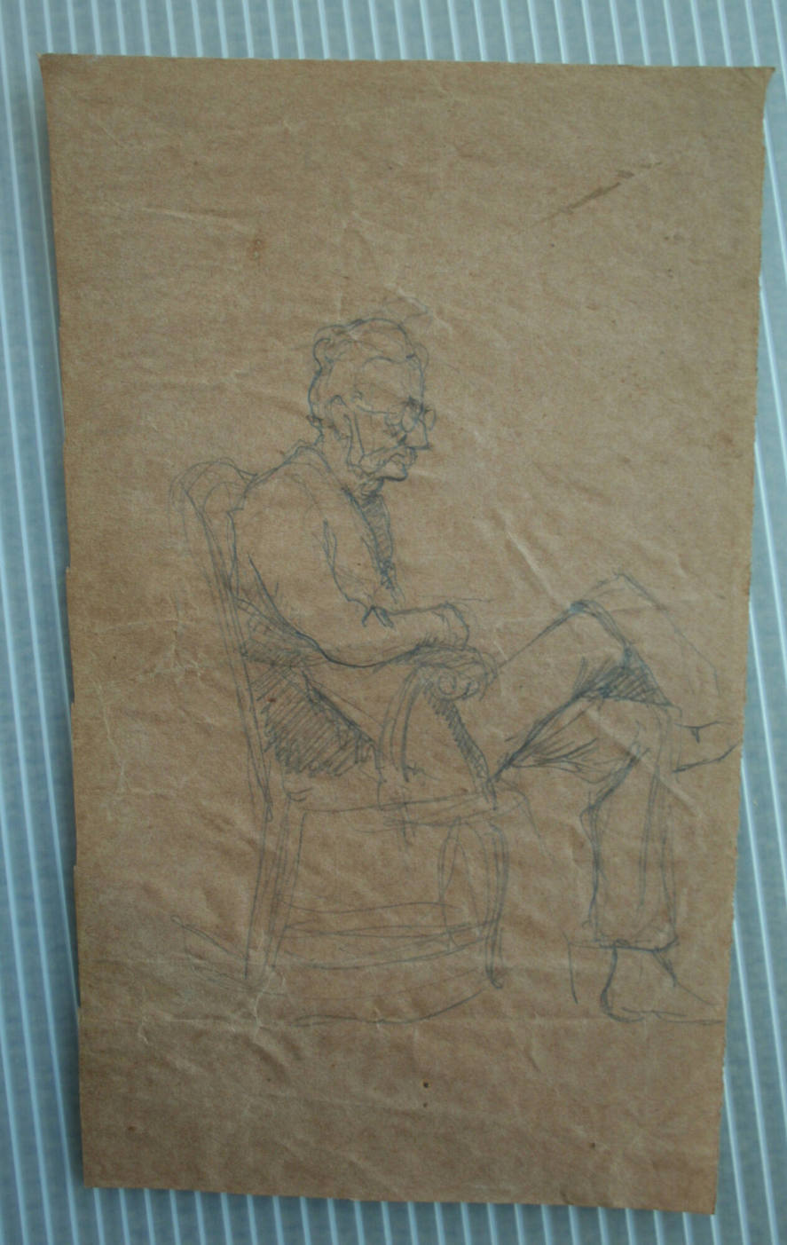 Old Man With Glasses and Legs Crossed